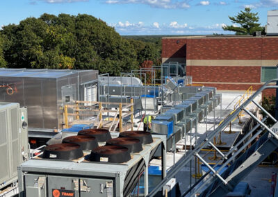 Trane Units On Roof With Trees In Background